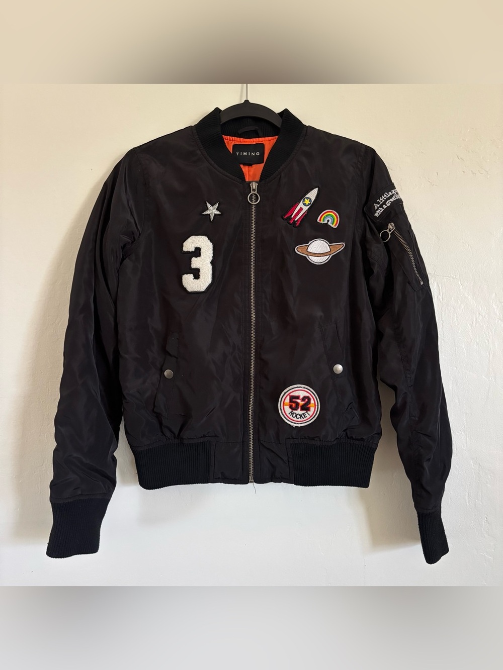 Timing Woman’s Black Bomber Jacket with Orange Lining